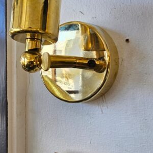 Short brass arm knuckle wall light with brass ES Sleeve
